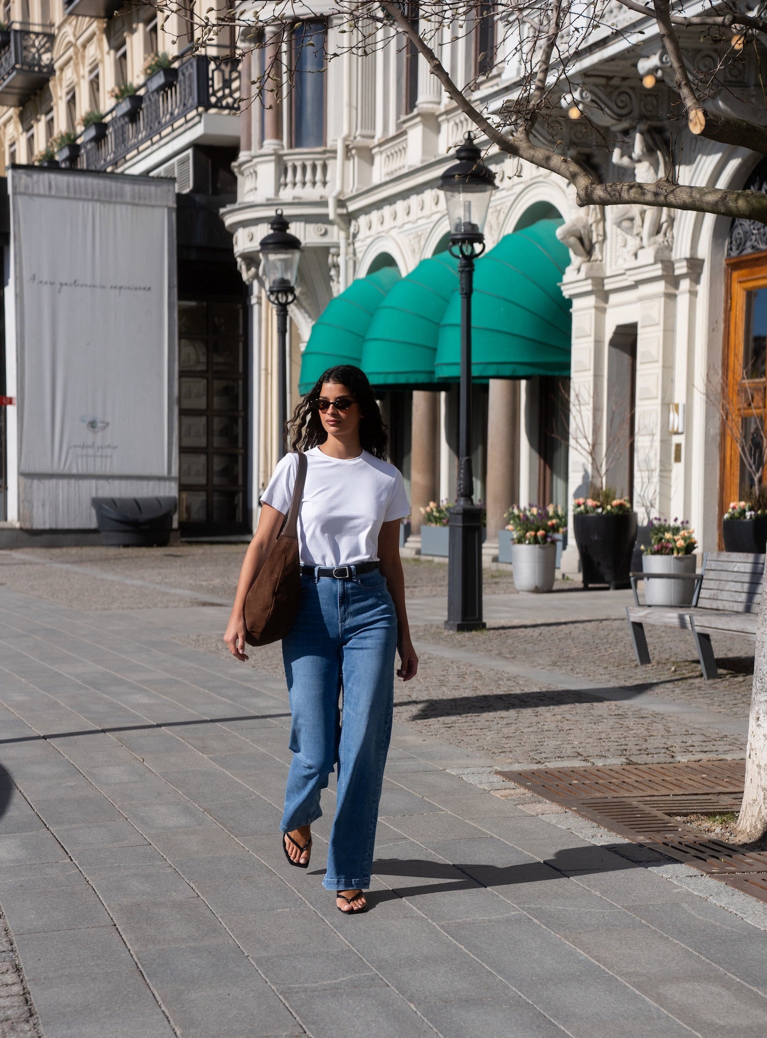 Woman in Ninepine Summer Jeans and a fitted Pima cotton t-shirt, highlighting a soft, high-quality top paired with comfortable denim for everyday wear